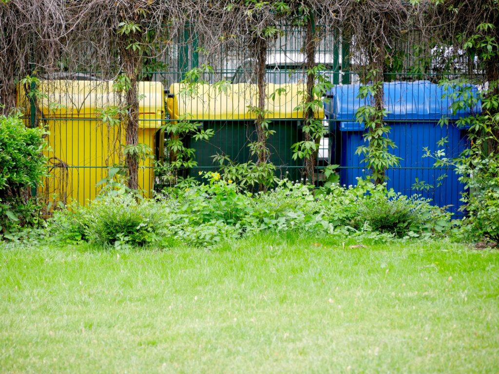 trash can area behind a fence